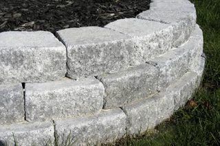 How to Put Edge Pavers Around a Tree | eHow Stone Flower Beds, Backyard Retaining Walls, Building A Retaining Wall, Landscaping Around Trees, Building Raised Beds, Stone Planter, Raised Vegetable Gardens, Landscape Borders, Brick Patio