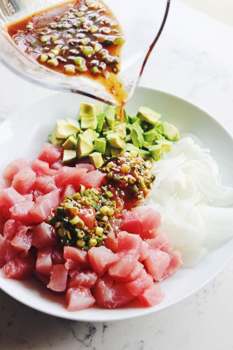 This spicy ahi (also known as bluefin) tuna poke recipe is simple, fresh, and delicious. It\'s inspired by the Hawaiian poke bowls that my husband enjoyed while traveling as a teenager. Best of all, the whole thing comes together in under 30 minutes with minimal ingredients! Tofu Poke Recipe, Spicy Ahi Poke Recipe, Bluefin Tuna Recipe, Tuna Poke Recipe, Ahi Tuna Poke, Hawaiian Poke, Tuna Ceviche, Poke Recipe, Sushi Recipes Homemade