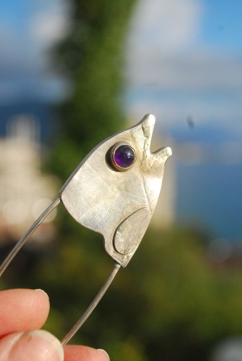 Handmade jewelry silver fish brooch shaped like a fish head. Large safety pin brooch is February birthstone gift. Pisces gift. Unique brooch for shawl, scarf, sweater or kilt. Sterling silver gemstone jewelry.  amethyst stone brooch.  Fish brooch for woman.  Coat brooch / scarf pin / kilt pin / sweater pin brooch.  Ready to ship  Our other works:  https://www.etsy.com/shop/FaunaSilverGems Fish Jewelry Silver, Coat Brooch, Brooch Scarf, Funky Fish, Kilt Pin Brooches, Woman Coat, Safety Pin Jewelry, Scarf Sweater, Fish Head