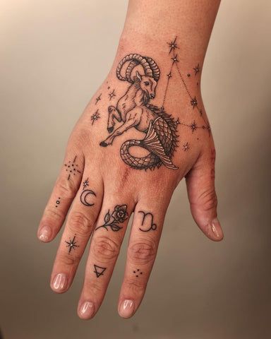 Capricorn Tattoo for Men Small Capricorn Tattoo For Men, Capricorn Tattoo Finger, Capricorn Hand Tattoo, Sea Goat Tattoo Capricorn, Capricorn Aesthetic Tattoo, Capricorn Goat Tattoo, Unique Capricorn Tattoo Ideas, Capricorn Tattoo For Men, Capricorn Zodiac Tattoo