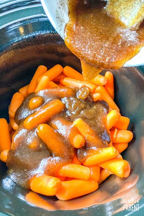 Slow Cooker Glazed Carrots: Not Just For Thanksgiving! [recipe + video] Crockpot Candied Baby Carrots, Carrots In Crockpot Slow Cooker, Crock Pot Honey Glazed Carrots, Cracker Barrel Carrots Crockpot, Candy Carrots Recipe Crockpot, Slow Cooker Brown Sugar Carrots, Crockpot Glazed Carrots Recipe, Sweet Glazed Carrots Recipe Crockpot, Carrots Crockpot Brown Sugar