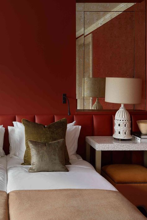 Red bedrooms are bold and striking alternatives to neutral spaces. Discover ideas for paint, wallpaper, bedding, rugs, curtains, furniture, and more. #redbedroomideas #moodybedroomideas #falldecor #cozyfallbedroom #apartmentdecor #apartmentdecoratingonabudget #apartmentliving #smallspacedecorating #thespruce Sloped Ceiling Bedroom Ideas, Red Bedroom Ideas, Dark Academia Bedroom Ideas, Moody Bedroom Ideas, Small Bedroom Layout, Cozy Fall Bedroom, Red Bedroom, Neutral Bedrooms, Apartment Decorating On A Budget