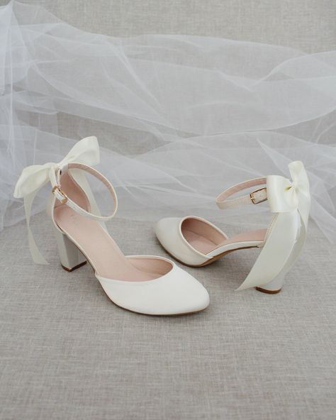 An all-time classic and elegant style with simplicity of satin heels with a satin back bow. DETAILS:HEEL HEIGHT: 3 inchesCOLORS AVAILABLE: Champagne, White, Ivory, Navy, Burgundy, and Light BlueUPPER: Synthetic upper and liningMATERIALS: Mandmade outsoleSTYLE NAME: SARAH Light Blue Heels With Bow, Wedding Flats With Bow, White High Heels With Bows, Bride Shoes Short Heel, Bow Heels White, Two Inch Heels, White Heels Elegant, White Prom Shoes Low Heels, Ivory Satin Heels