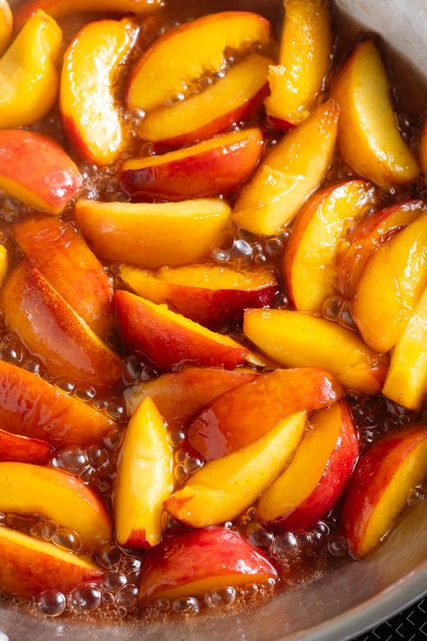 These Caramelized Peaches require only 5 ingredients and take just 10 minutes to make! They're sweetened with maple syrup, packed with flavor, and they make the perfect topping for any dessert, ice cream, or breakfast. Try them on pancakes or oatmeal! Caramelised Peaches, Peach Pancake Topping, Peaches In Syrup, Sauteed Peaches And Ice Cream, Unripe Peaches Recipes, Peach Topping For Pancakes, Peach Topping For Ice Cream, Overripe Peaches Recipes, Peach Topping