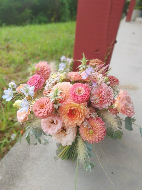 Apricot and Salmon mid Summer Bridal Bouquet of Dahlia, lisianthus, Delphinium, zinnia, and grasses Coral Dahlia Bouquet, Garden Wedding Bridal Bouquet, Dahlias Bridal Bouquet, Dahlia Zinnia Bouquet, Dahlia Market Bouquet, Dahlia Flower Bouquet Wedding Ideas, Zinnia Bouquet Ideas, Dahlia And Peony Bouquet, August Wedding Flowers Bride Bouquets