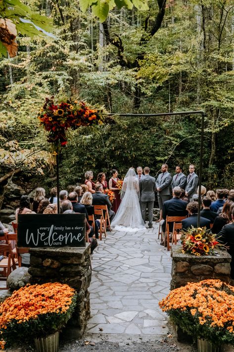 Bright oranges, yellows, reds and purples in the flowers | Huge orange mums | Wood welcome sign | Echelon Florist | Smoky Mountain Wedding | National Park Wedding | Fall Wedding | Spence Cabin Ceremony | Appalachian Clubhouse Reception | Derek Halkett Photography | Absolute Wedding Perfection Mums Flowers Wedding Decor, Mums Fall Wedding, Fall Foliage Wedding Decor, Mums At Wedding Ceremony, Fall Wedding Pergola, Fall Wedding Venue Decor, Fall Wedding Elopement Ideas, Fall Cottage Wedding, Tennessee Fall Wedding