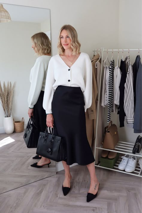 Mules Office Outfit, Satin Skirt Smart Casual, Black Slip Skirt Styling, White And Black Office Outfit, White Cardigan And Skirt Outfit, Black Silk Skirt Fall Outfit, Silk Skirt And Cardigan Outfit, Slip Skirt Office Outfit, Bias Skirt Outfit Summer