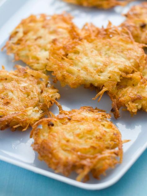 The holiday experts at HGTV.com share a quick and easy potato latke recipe you can serve at your next Hanukkah meal. Latke Recipe, Hannukah Recipes, Potato Latke Recipe, Potatoe Pancake Recipe, Jewish Holiday Recipes, Hanukkah Food, Frozen Potatoes, Potato Latkes, How To Make Potatoes