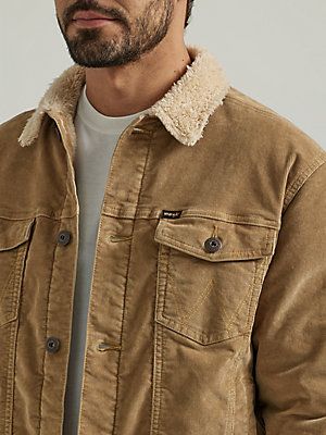 WINTER-READY STAPLEWinter weather doesn't stand a chance against this stylish Wrangler® men's sherpa-lined corduroy trucker jacket. The style is equipped with warm sherpa lining and a comfortable corduroy exterior for double the warmth and an understated vintage vibe. The corduroy sherpa jacket has a classic 4-pocket style with twin chest flap pockets and our signature 'W' stitching. Stay warm and in style this season—layer this jacket over your favorite crewneck sweatshirts for a casual look you can wear any day of the week. Mens Sherpa Jacket Outfit, Trucker Jacket Men Outfit, Teen Boy Clothing, Gifts For My Bf, Boy Clothing Styles, Mens Sherpa Jacket, Sherpa Jacket Outfit, Corduroy Trucker Jacket