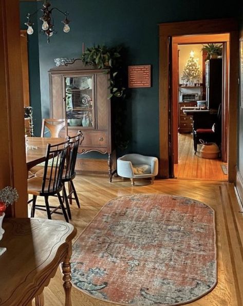 Dark Green Wainscoting Living Room, Moody Family Living Room, Panelled Vaulted Ceiling, Rustic Eclectic Interior Design, Moody Farmhouse Interior Design, Dark Green Walls Wood Trim, Botanical Home Decor Living Room, Drumset In Living Room, Moody Vintage Room