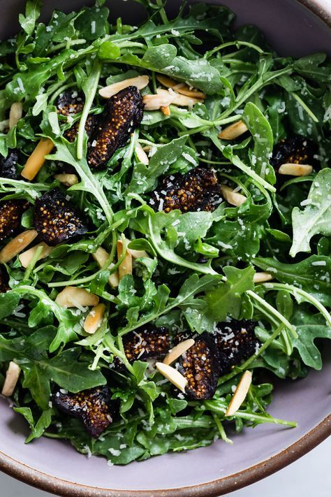 The simplest five-minute arugula salad recipe with figs and toasted almonds. Easy enough for weeknights and festive enough for the holiday table, this back-pocket arugula salad recipe hardly needs a recipe! #recipe #arugula #easy #quick #salad #healthy #glutenfree #figs #driedfigs #figsalad #holiday #almonds #parmesan Arugula And Fig Salad, Fig Arugula Salad, Arugula Fig Salad, Christmas Arugula Salad, Argula Recipes Salad, Recipe Arugula, Starter Salad, Salad Arugula, Fig Salad