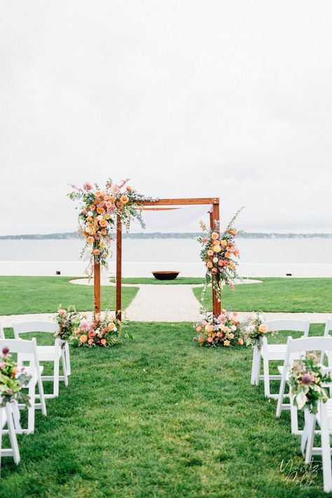 Wedding Arch Flowers Colorful, Wildflower Arbor Decor, Summer Wedding Arch Flowers, Colorful Ceremony Arch, Summer Wedding Arbor, Wedding Flowers Arbor, Wildflower Wedding Alter, Spring Wedding Alter, Spring Wedding Arch Ideas