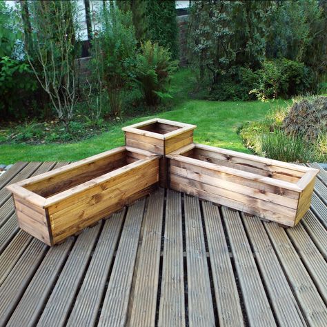 This corner planter set is a unique addition to any garden. Featuring two troughs and a square planter. Made in Britain, and fashioned from FSC Timber and Scandinavian Redwood, this set is incredibly durable. Featuring a slatted base for drainage. Components can be used separately. Corner Planter, Planter Trough, Decking Patio, Deck Remodel, Uk Summer, Trough Planters, Wooden Planter Boxes, Wooden Planter, Square Planters