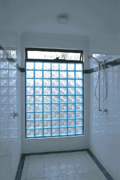 Vented Glass Block shower wall.  Replace outside shower wall with this!  Also like the black horizontal  trim strip in the walls.  Could we do custom insert for this effect? Farmhouse Window Treatments Kitchen, Bathroom Windows In Shower, Glass Block Shower Wall, Creative Window Treatments, Windows Treatments, Glass Block Shower, Studio Garage, Glass Blocks Wall, Farmhouse Window Treatments