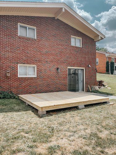 Wood Deck Designs, Ground Level Deck, Building A Floating Deck, Build A Deck, Digging Holes, Floating Deck, Wooden Deck, Patio Deck Designs, Deck Posts