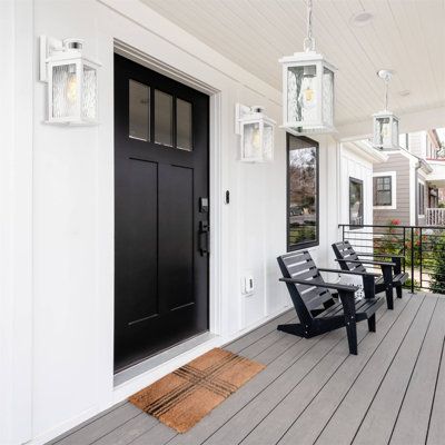 This porch-style outdoor chandelier features a matte white finish and tempered water ripple glass to complement the different finishes and allow your personal style to shine through. The clear water glass creates beautiful ripples in the bulb while still allowing plenty of illumination to illuminate your home space. It creates a warm and inviting atmosphere in your house. | Breakwater Bay Jacquiline White Outdoor Pendant Light, Farmhouse Hanging Light Fixtures Ceiling Mount Porch Light | 10 H x Hanging Porch Lights, Outdoor Porch Lights, Outdoor Pendant Light, Front Porch Lighting, Porch Styles, Modern Outdoor Wall Lighting, Wood Light Fixture, Handcrafted Lamp, Outdoor Chandelier