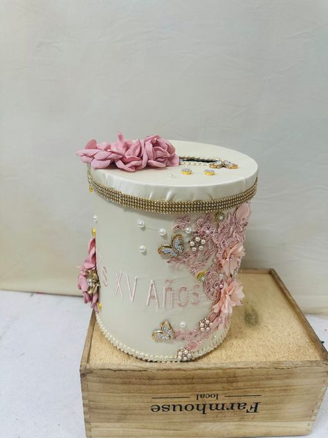 This money box is a great gift option, with a unique cylindrical shape and a stylish design that includes beautiful 3D flower lace, pearls, and brooches. Measuring approximately 12"x8" and available in multiple colors, it's a versatile and elegant way to store your money and gift cards. Ceremony Pillow, Quinceanera Pillows, Pillow Bible, Photo Album Guest Book, Crown Pillow, Money Gift Card, Small Crown, Cash Holder, Flower Lace