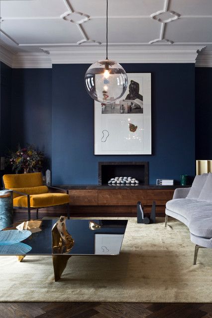 9 Interior Decor Living Rooms in Moody Blue - Interiors By Color Blue Accent Wall Living Room, Blue Living Room Color Scheme, Blue Living Room Color, Mustard Living Rooms, Blue Walls Living Room, Yellow Decor Living Room, London Living Room, Dark Blue Living Room, Navy Living Rooms