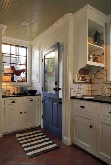 Terra cotta floors, black granite counters, white cabinets, subway tile | Designers: Nathan Waldon and Tom Berkelman  Photo: Carlos Avila Gonzalez / The Chronicle Tudor Kitchen, Kitchen Technology, Blue Shutters, Kitchen Decor Inspiration, Tuscan Kitchen, Mediterranean Home Decor, Mediterranean Home, Kitchen Doors, Kitchen Plans