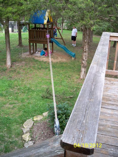 pulley system with bucket that goes from our deck to the "tree house"-- also serves as a clothesline #backyardplayhouse Bucket Pulley Tree Houses, Tree House Pulley System, Treehouse Pulley System, Pulley Ideas, Simple Playhouse, Utility Room Ideas, Play Structures For Kids, Kids Yard, Outdoor Play Space