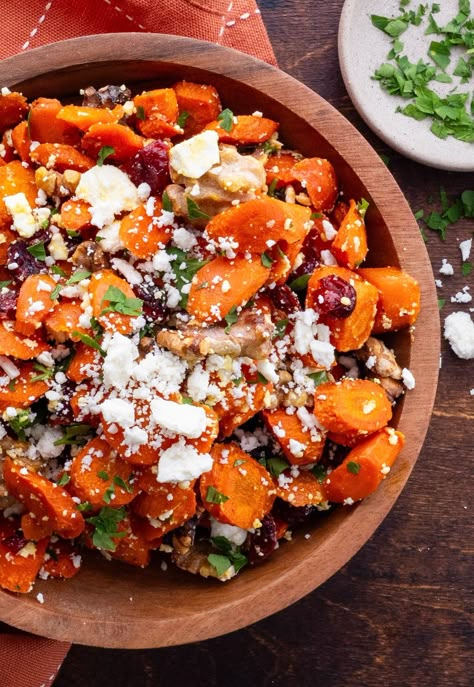 Maple Roasted Carrots with dried cranberries, feta cheese, walnuts and a buttery maple syrup glaze. This simple, flavorful approach to roasted carrots adds a unique spin to classic roasted carrots, creating the perfect side dish for holiday dinners. Horseradish Carrots, Roasted Carrots With Feta, Carrots With Feta, Maple Carrots, Maple Roasted Carrots, Maple Syrup Glaze, Thanksgiving Spread, Charcuterie Meats, Roasted Carrots Recipe