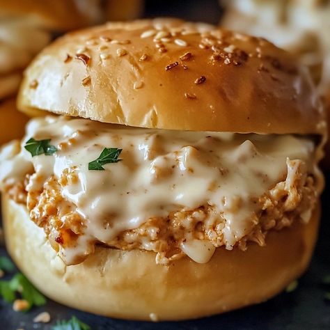 If you're craving a comfort food mashup that's both creamy and indulgent, Chicken Alfredo Sloppy Joes are the answer. This creative take on the classic Sloppy Joe sandwiches combines tender shredded chicken with a rich, creamy Alfredo sauce, all piled on a soft bun for the ultimate meal. It’s a twist on the traditional that’s sure to become a new family favorite. What makes these Chicken Alfredo Sloppy Joes so special is the combination of flavors. The creamy Alfredo sauce blends perfectly ... Fluffy Bun, Chicken Sloppy Joes, Sloppy Joes Sandwich, Creamy Alfredo Sauce, Thanksgiving Leftover Recipes, Gluten Free Buns, Dairy Free Cream, Savory Chicken, Sloppy Joe