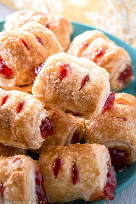 This easy strawberry strudels recipe is probably one of the most efficient desserts to feed a crowd! 1 sheet of puff pastry makes 30 bite-sized pieces and you can use jam or preserves (learn my little tip to help keep the jam stay together.) NO egg wash, simple ingredients, easy & tasty!