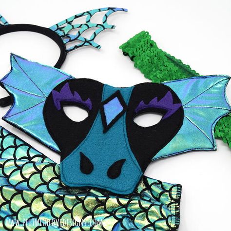 Sew a felt dragon mask for your child's (or your) dragon costume with this tutorial. Whether you are trick or treating this year or staying home and enjoying Halloween costumes and fun at home, this dragon mask will add the perfect touch to any DIY dragon costume. You may use the tutorial to make things to sell, handmade gifts for family and friends, and more. The tutorial includes detailed steps with photos for creating your own dragon mask. Rainbow Dash Costume, Diy Dragon Costume, Felt Dragon, Game Of Thrones Gifts, Felt Glue, Dragon Mask, Felt Mask, Dragon Costume, Mask Pattern