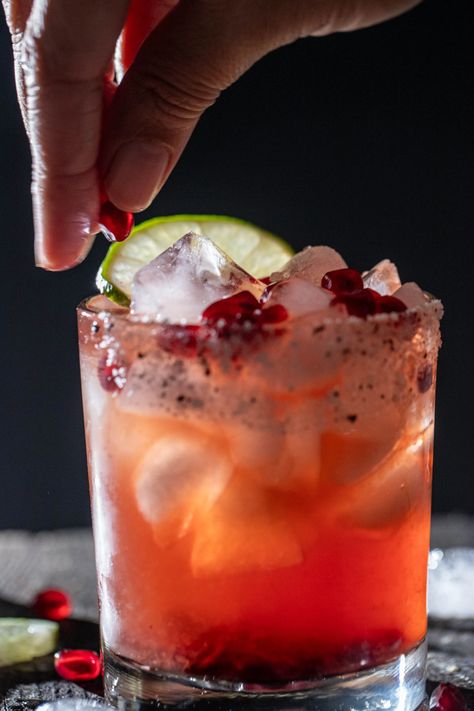 A vibrant fusion of pomegranate and tequila in a refreshing Pomegranate Tequila Margarita. A cocktail for any occasion. Coconut Pomegranate Margarita, Pomegranate Tequila Drinks, Pomegranate Rum Cocktail, Mediterranean Cocktail Recipes, Pomegranate Margarita Recipe Pitcher, Pomegranate Margaritas, Pomegranate Tequila, Pomegranate Cocktail, Coconut Tequila