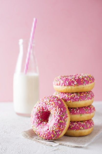 Stack of pink and white donuts with bottle of milk over pink Premium Photo Doughnuts Photography, Baking Wallpaper, Donut Decorating Ideas, Pastel Desserts, Donut Store, Bottle Of Milk, Donut Art, Decadent Food, Sugar Donut