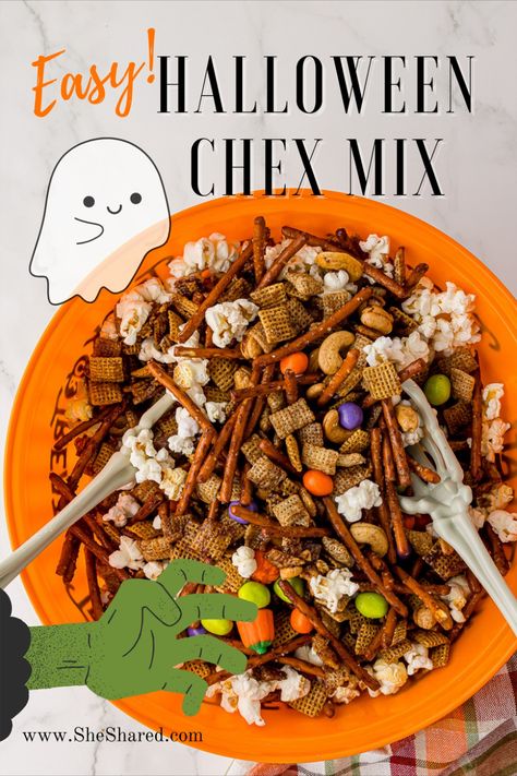 A large Halloween bowl filled with Halloween Chex Mix, a plastic skelleton hand inside on a white countertop Halloween Chow Chex Mix Recipe, Work Halloween Potluck Ideas, Monster Chex Mix Recipes, Popcorn Chex Mix Recipes, Halloween Potluck Ideas For Work, Halloween Trail Mix Recipe, Halloween Chex Mix Recipes, Halloween Trail Mix, Halloween Potluck