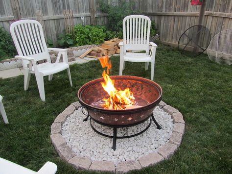 simple, use the brazier we have and just pebble under it so it won't kill the grass! Simple Diy Fire Pit Area, Fire Pit Grass Area, Portable Fire Pit Ideas Backyards, Basic Fire Pit Ideas, Pebbles Around Fire Pit, Fire Pit In Grass Area, Fire Pit Simple, Simple Diy Fire Pit, Fire Pit On Grass Backyard Ideas