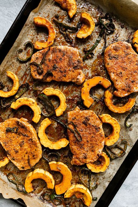 A perfect fall dinner that comes together quickly, this recipe for Pork Chops in the Oven is everything you want in a weeknight meal. It's easy to make and easy to clean up, beautiful on the plate, and full of well-balanced nutrition. Juicy, tender pork chops nestle among sweet delicata squash and smoky poblano pepper with a crunchy garnish of squash seeds to top it off. Sheet Pan Pork Chops, Sheet Pan Pork, Delicata Squash Recipe, Pan Pork Chops, Baked Pork Chops Oven, Juicy Pork Chops, Delicata Squash, Boneless Pork Chops, Baked Pork