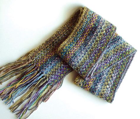 Linen stitch scarf using Noro silk garden on Size 10 needles. Bohemian Knitted Scarves In Acrylic Yarn, Linen Stitch Knitting, Bohemian Knitted Acrylic Yarn Scarf, Linen Stitch Scarf, Bohemian Multicolor Knitted Scarf, Bohemian Hand-dyed Multicolor Silk Scarf, Linen Stitch, Both Sides, Knit Patterns