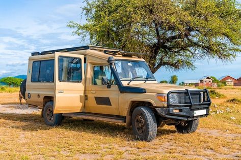 Photo safari jeep driving on busy dirt r... | Premium Photo #Freepik #photo #african-safari #savannah #road-trip #car-travel Savannah Landscape, Jeep Driving, Safari Car, Safari Jeep, Ngorongoro Crater, Tanzania Africa, Dirt Road, Scary Stories, African Safari