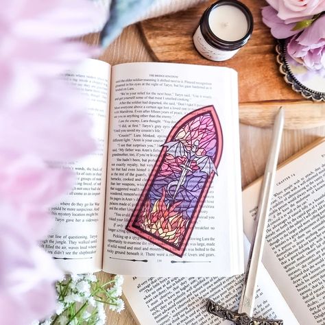 Our most popular stained glass style bookmark 🩷😊 Qotd: what's your favourite book with dragons in? I'd love to find some time to make more of these soon! #bookish #bookmarks #bookmerch #fantasybooks #dragon #art #stainedglass Ouabh Bookmark, Bookish Bookmarks, Fantasy Bookmarks, Bookshelf Art, Book Merch, Making Stained Glass, Diy Bookmarks, Glass Style, Popular Books