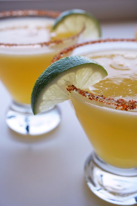 Taj?n Rimmed Mango Margaritas Sweet Margarita Recipe, Fresh Margarita Recipe, Baked Fish Tacos, Mango Margaritas, Mango Margarita Recipe, Tajin Recipes, Fresh Margarita, Mango Slices, Ripe Mango