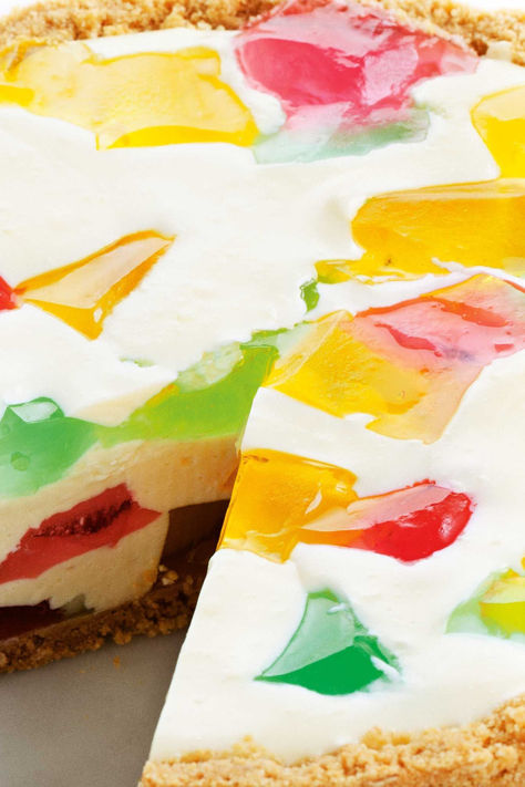 We put a lot of fun into a luscious cheesecake with a rainbow of jelly cubes. Jello Cheesecake Recipes, Cheesecake With Jello, Two Ingredient Desserts, Jelly Cheesecake, Jello Cheesecake, 5 Star Recipes, Rainbow Recipes, Bake Cheese, Rainbow Jelly