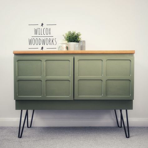 Nathan Mid Century Modern drinks cabinet / sideboard / media unit.  We cleaned and sanded the whole unit before paint the main body in Bayberry by Fusion mineral paint. The top has been sanded back to bare wood then given 3 coats of varnish. This has brought the grain out beautifully as well as adding durability. This sage green colour really compliments this piece perfectly, we have the piece a lift on black hairpin legs. We think this really elevates the piece giving it a modern twist. Office Adu, Modern Drinks Cabinet, Wooden Sideboard Cabinet, Green Sideboard, Nathan Furniture, Vintage Drinks, 70s Interior, Sideboard Drinks Cabinet, Retro Sideboard