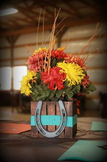 I added ribbon and a mini cast iron horseshoe to little wooden flower arrangements I found at Walmart. Tied in nicely with our little western wedding! Western Centerpieces, Mini Cast Iron, Quince Decorations, Quinceanera Decorations, Western Theme Party, Horseshoe Crafts, Western Parties, Cowboy Theme, Country Theme