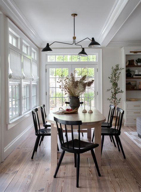 The beauty of this dining space is that it is both beautiful AND functional.  The young family of five needed a casual dining areas where the parents could easily move between kitchen, family room and eating area.  With an open floor plan, we were able to create specific areas that were discrete but also connected.  Perfectly framed between the windows and French doors, this dining area allows for seamless connection to the family's active life. Dining Table By French Doors, Dining Table French Doors, Walking Into Dining Room From Front Door, Dining Room Connected To Living Room, Small Dining Room With Patio Doors, Dining Room With French Doors, Dining Room With Windows, Closing Off Dining Room French Doors, Duck Egg Blue Kitchen