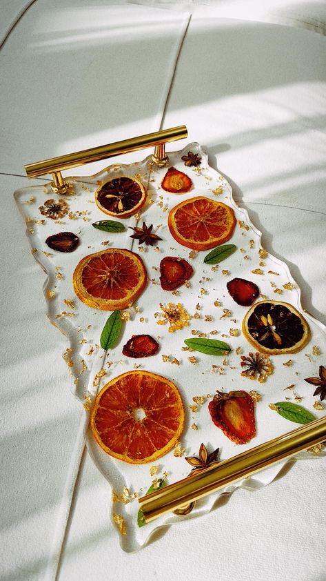 Natural dried fruits, spices and greens will create a wonderful mood for you. The tray is made of epoxy resin. Treat with care, if dirty, wipe with a damp cloth, then dry. Do not wash in the dishwasher. Do not scratch. Size: length 29cm, width 18cm, height 4cm Dried Fruit Resin, Resin Inspiration, Epoxy Furniture, Epoxy Resin Tray, Epoxy Tray, Epoxy Ideas, Epoxy Resin Projects, Resin Tray, New Project Ideas