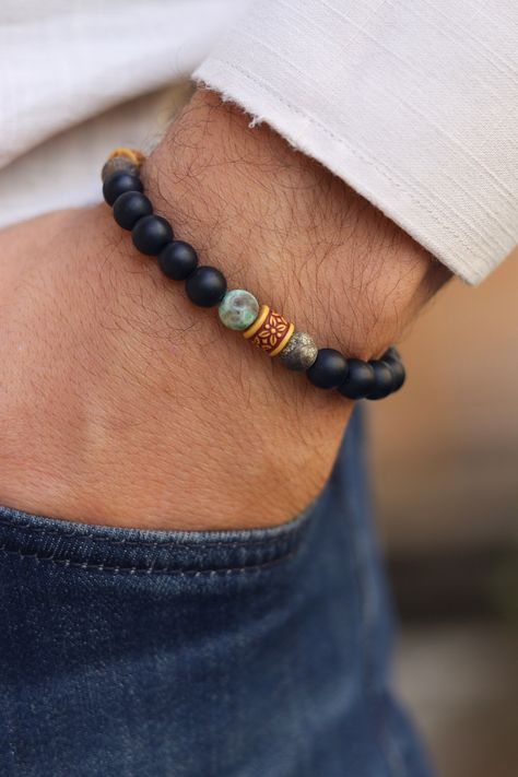 Matte Black Onyx and Tibetan Agate , Balance Bracelet, Mens Bracelet, Stretch Bracelet, Gemstone Bracelet, Healing Bracelet,Men gifts    Matte Black onyx is a powerful protection stone that absorbs and transforms negative energy, and helps to prevent the drain of personal energy. Black onyx aids the development of emotional and physical strength and stamina, expecially when support is needed during times of stress, confusion or grief.  Tibetan Agate -  Highly regarded as a talisman since ancient Handmade Mens Jewelry, Men Gemstone Bracelet, Custom Beaded Bracelets, Stone Bracelet For Men, Stone Beads Bracelets, Men’s Bracelet Designs, Male Bracelets, Mens Bracelet Diy, Beaded Bracelets For Men