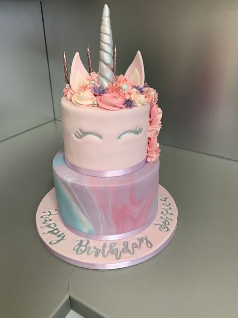 A two tier fondant unicorn cake with marbled fondant and buttercream mane. Lettering done using Sweet Stamp. 2 Tier Unicorn Cake Design, Two Tier Unicorn Birthday Cake, Unicorn Two Tier Cake, Two Tier Fondant Cake, Unicorn Cake Two Tier, Unicorn Cake 2 Tier, Tort Unicorn, Marbled Fondant, Unicorn Cake Design