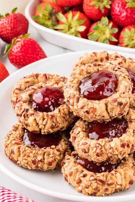 Thumbprint Cookies - A super simple, but festive classic Christmas cookie! Baked to perfection and topped with jam. Thumb Prints Cookies, Thumb Print Cookies With Jelly, Thumbprint Christmas Cookies, Thumb Print Cookies Recipes Christmas, Oatmeal Thumbprint Cookies, Thumbprint Jam Cookies, Easy Thumbprint Cookies, Christmas Thumbprint Cookies, Almond Thumbprint Cookies