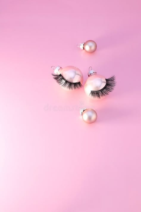 False eye lashes on Christmas ball on pink background, copy space royalty free stock images Background Eyelash, Christmas Lashes Wallpaper, Lashes Background, Christmas Lash Post, Pink Lash Background, Quotes Pink Background, Lashes Christmas, Christmas Lashes, Pink Lash Post