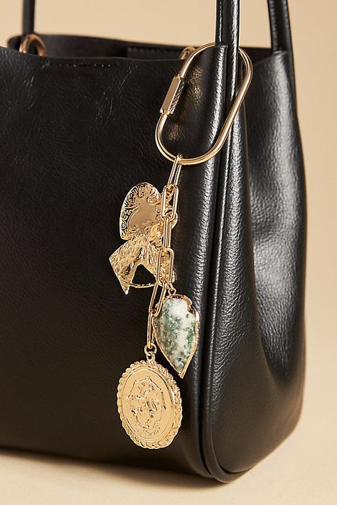 Charming new-trend alert: jewelry for your bag. | Brass & Stone Bag Charm by Anthropologie in Gold, Women's, Brass/Resin Purse Charms Aesthetic, Bag Charm Ideas, Bag Charms Aesthetic, Key Chains Aesthetic, Elegant Keychain, Diy Bag Charm, Purse Charms Diy, Luxury Keychain, Chains Aesthetic