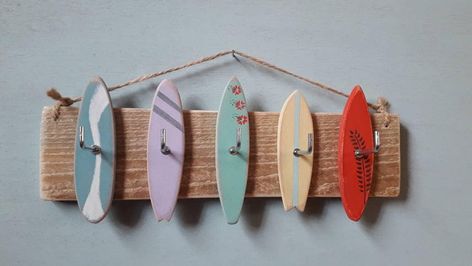 These very cool surfboard hooks can be used to hang jewellery, keys or medals. They are made from reclaimed wood and hung using natural twine. It measures approximately 28cm wide. Surfboard Key Holder, Coastal Cowgirl Apartment, Surfing Room, Surfboard Decoration, Surfer Bedroom, Beach House Paint Colors, Trendy Crafts, Decoration Surf, Costal Bedroom