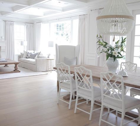 All white coastal styled interior with white walls, chairs, chandelier and sofa. Dining Room Table And Chairs, European White Oak Floors, White Dining Room, White Oak Floors, Coastal Living Rooms, Design Del Prodotto, White Rooms, White Houses, Floor Design