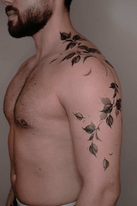 Arty's Floral Fantasies: How This Berlin-Based Artist Redefined Botanical Tattoos! | iNKPPL Vines Plant Tattoo, Black Tattoos Shoulder, Beautiful Tattoo Sleeve, Vine Arm Tattoo Men, Men’s Floral Tattoos, Floral Shoulder Tattoo Men, Foliage Sleeve Tattoo, Snake And Vine Tattoo, Male Floral Tattoo